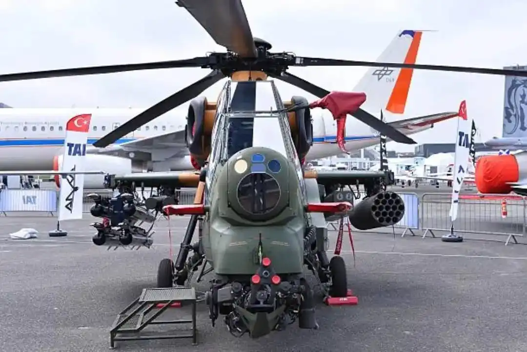 Close-up view of T129 weapon pylons fully loaded with ATGMs and CIRIT missiles
