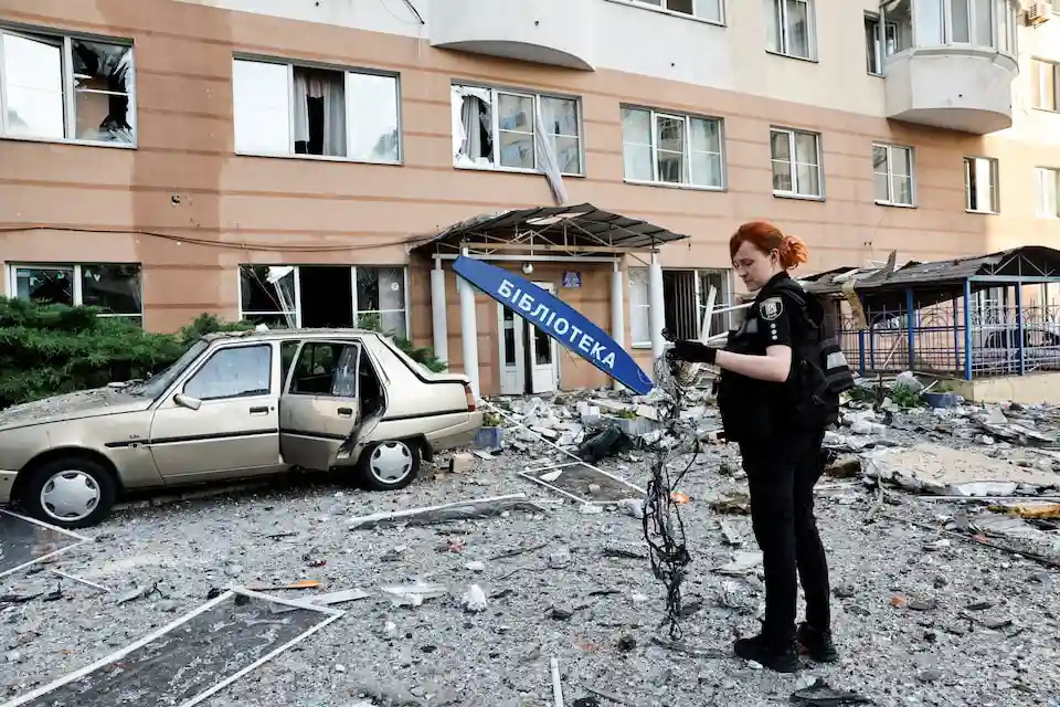 An investigator inspects the site where a Russian drone struck an apartment building in Kyiv, Ukraine June 6, 2025