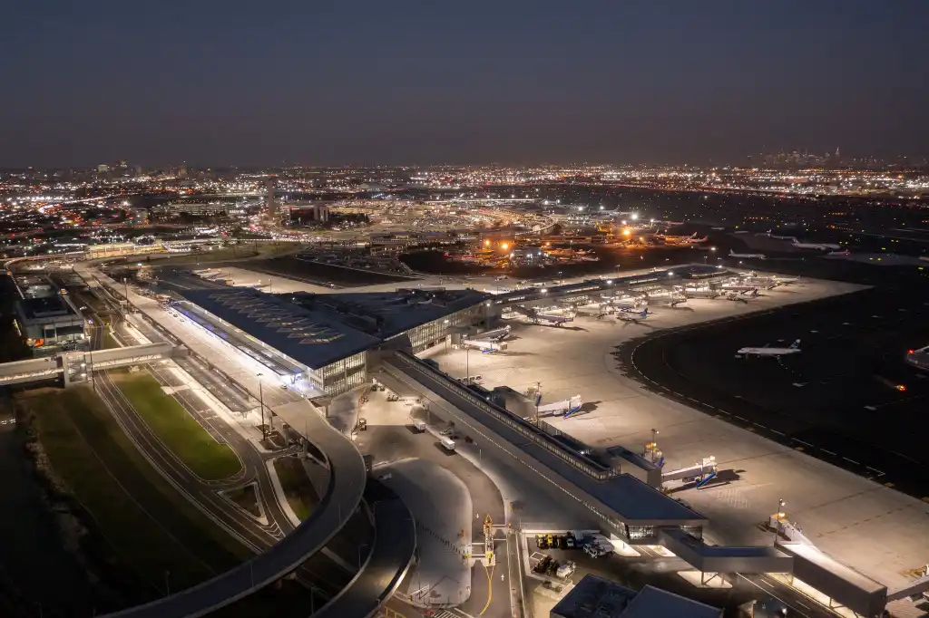 night view of Newark Liberty International Airport terminal with AirTrain passing by