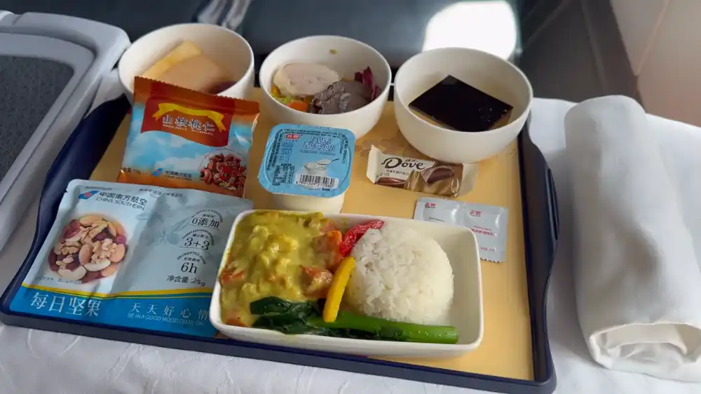 china southern a330-300 business class meal chicken curry rice fruit dessert