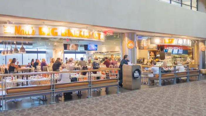 interior of Matt's Big Breakfast with morning travelers at Phoenix airport