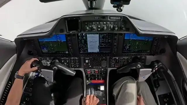 Phenom 100 cockpit at cruise with Garmin G1000 display in focus
