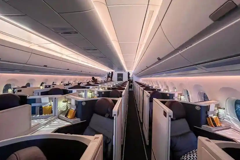Etihad A350 business-class suite with closing door and sconce lighting