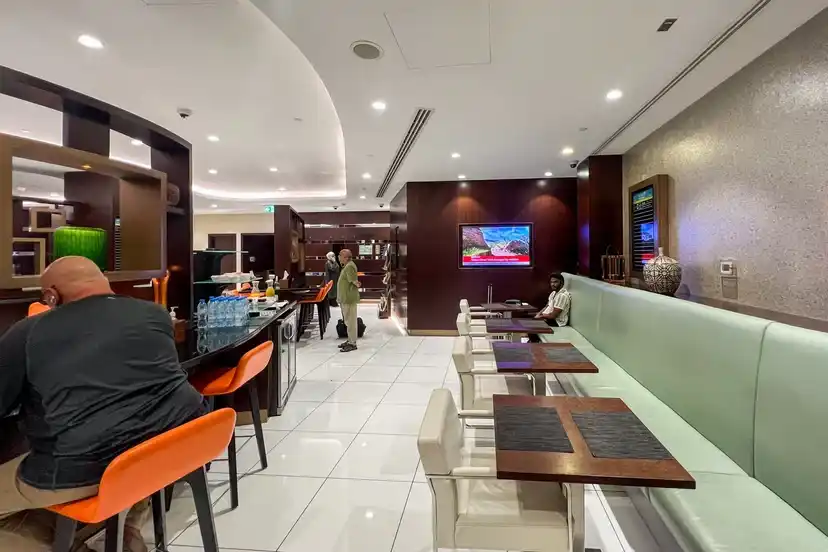 Etihad lounge amenities and business traveler seating at Abu Dhabi Terminal A
