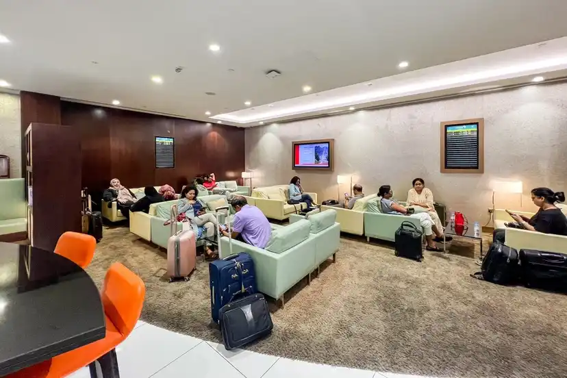 Etihad lounge amenities and business traveler seating at Abu Dhabi Terminal A