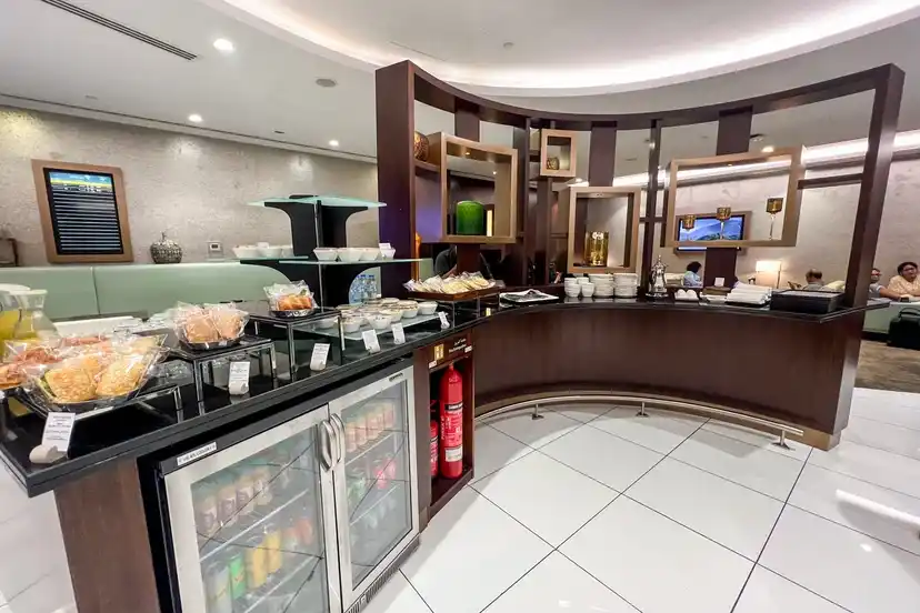 Etihad lounge amenities and business traveler seating at Abu Dhabi Terminal A