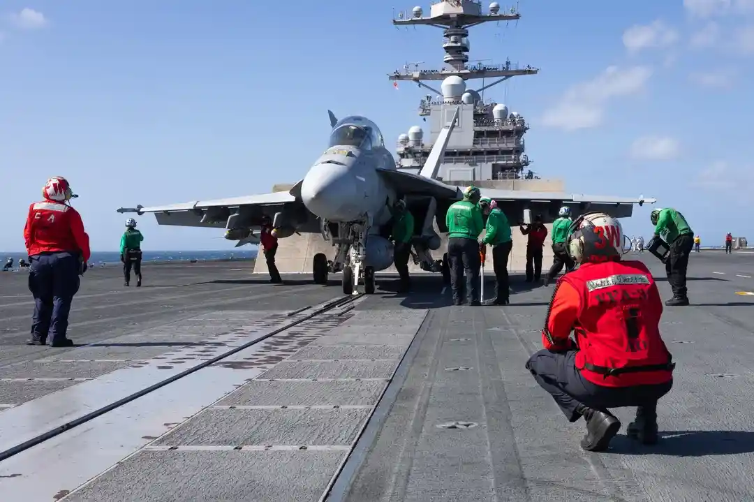 fa-18 super hornets on uss gerald r. ford preparing for launch