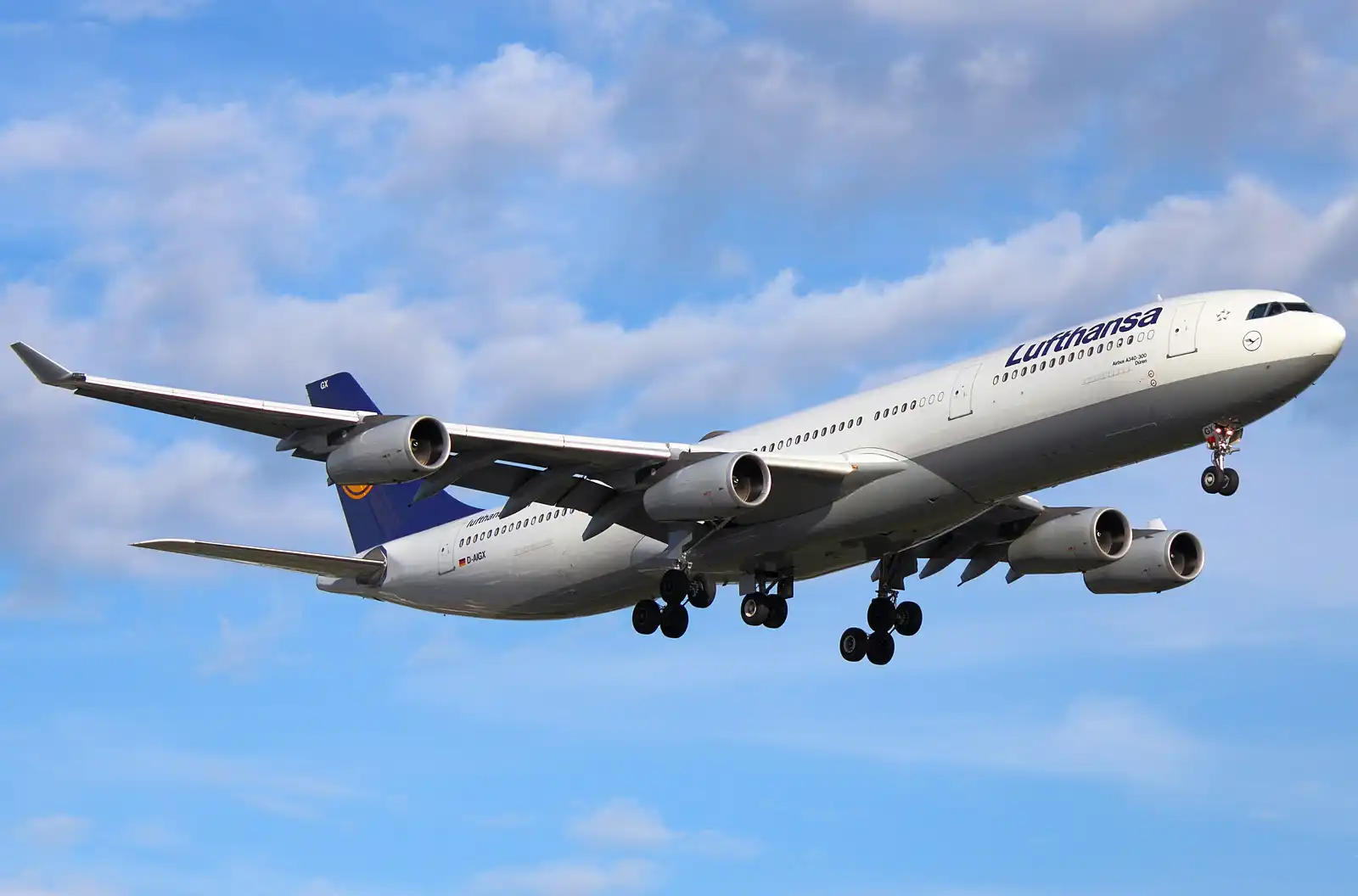 Lufthansa Airbus A340 departing at sunset