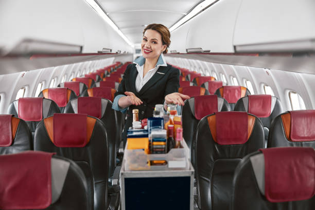 aisle seat airplane cabin service cart passing