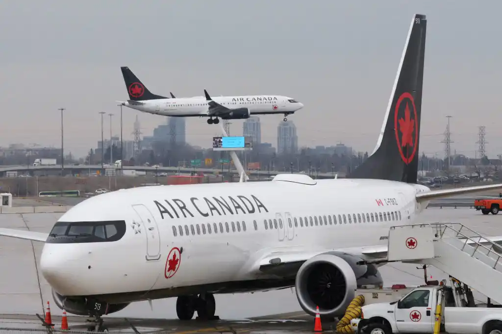 Air Canada hub operations with Airbus widebody and narrowbody aircraft at Toronto airport