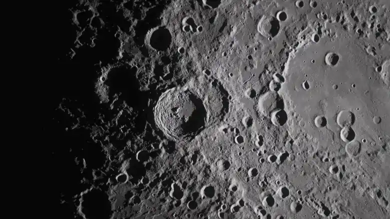 Artemis II Orion spacecraft capturing colorful lunar surface far side