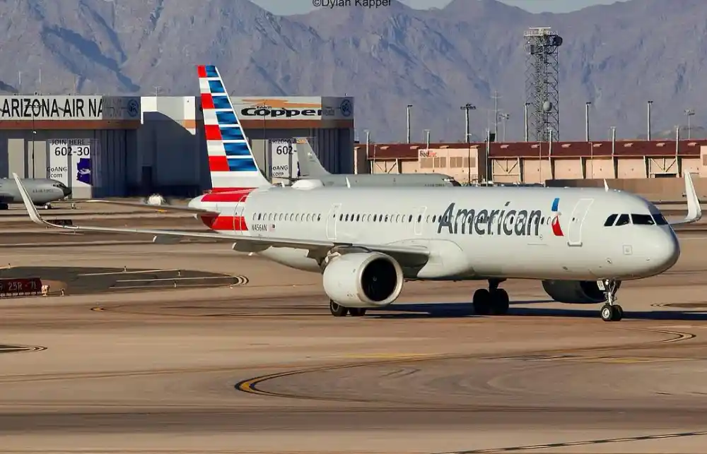 American Airlines Airbus A321neo at airport gate with Starlink inflight WiFi branding