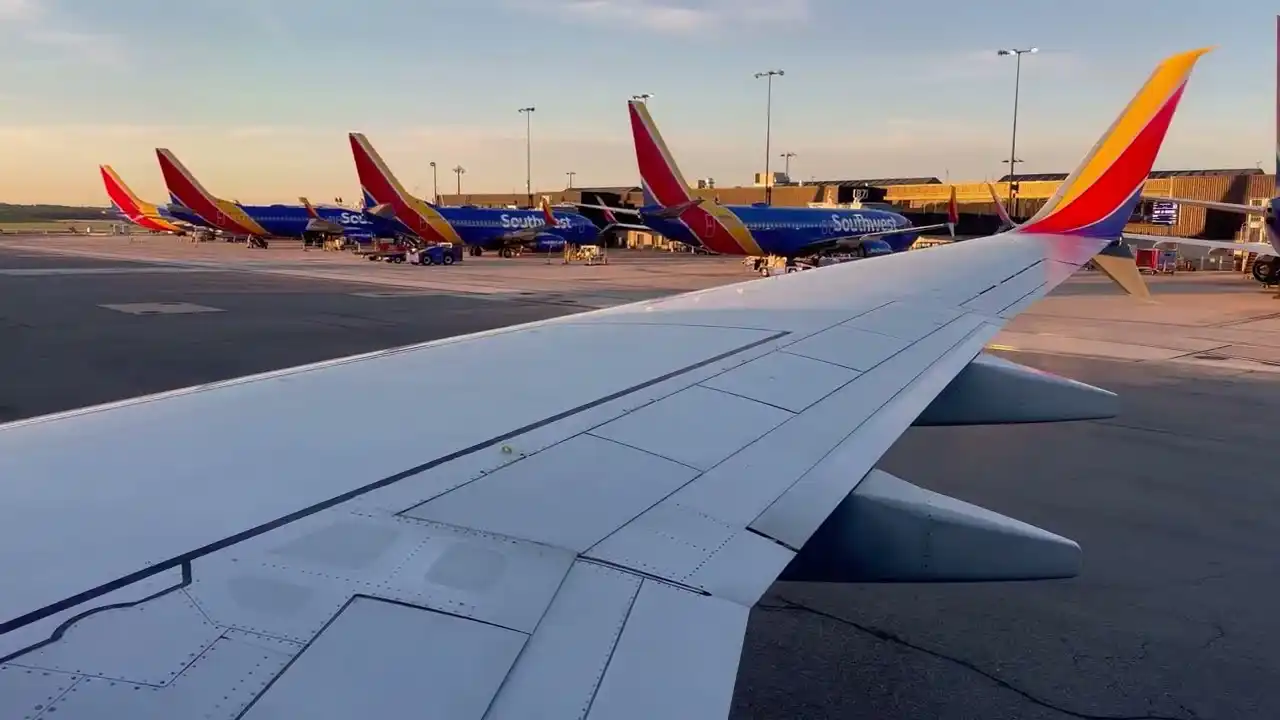 Southwest Airlines Boeing 737 taking off at sunrise domestic airport runway