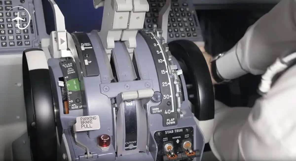 Boeing 737 manual trim wheel beside pilot seat