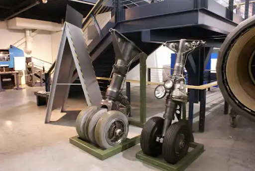 SR-71 maintenance crew servicing landing gear and tires on airbase ramp