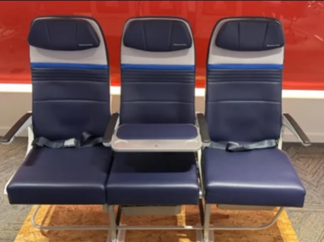 United Airlines Airbus A321XLR economy cabin with blocked middle seat tray table