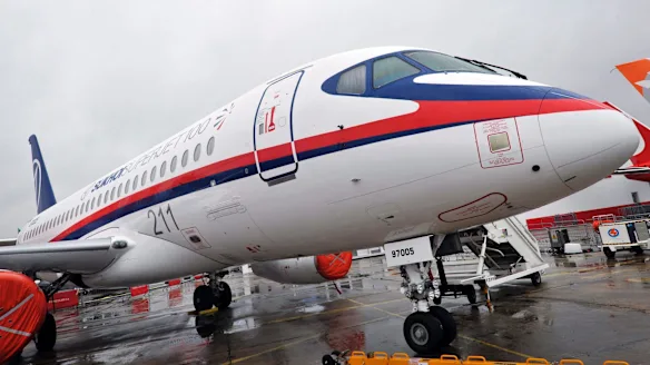Weathered Sukhoi Superjet 100 aircraft stored outdoors in Mexico