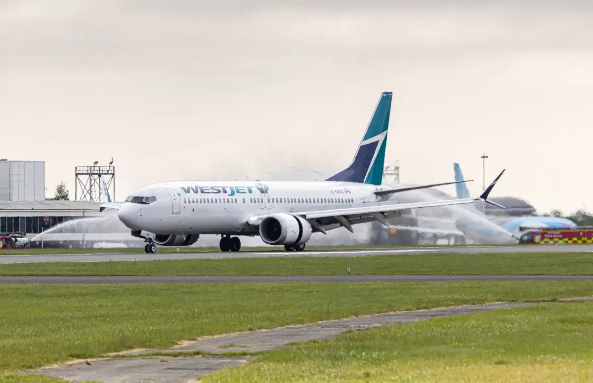 WestJet Boeing 737 MAX 8 arriving at Cardiff Airport inaugural Canada route