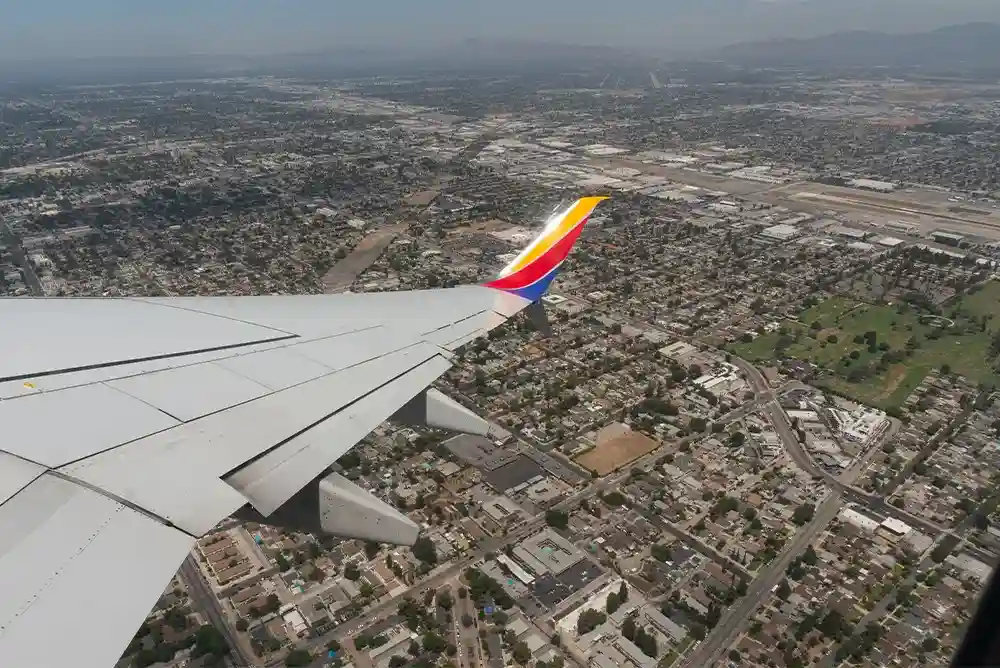aerial view of Hollywood Burbank Airport with Southern California mountains and Southwest aircraft