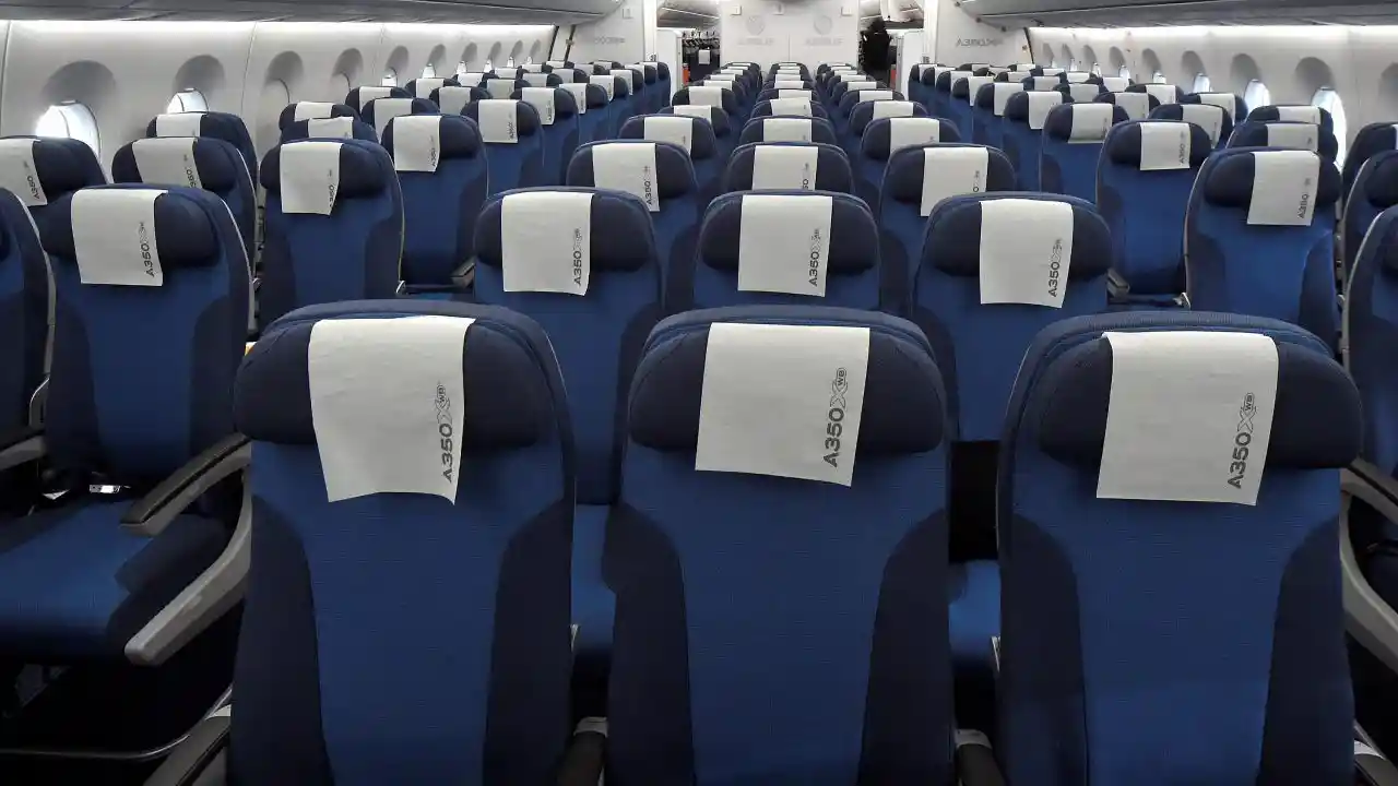 Airbus A350 passenger cabin with wide economy seats and large windows
