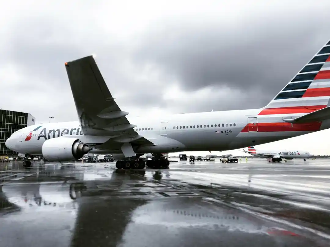 American Airlines Boeing 777-200ER widebody aircraft parked at airport terminal