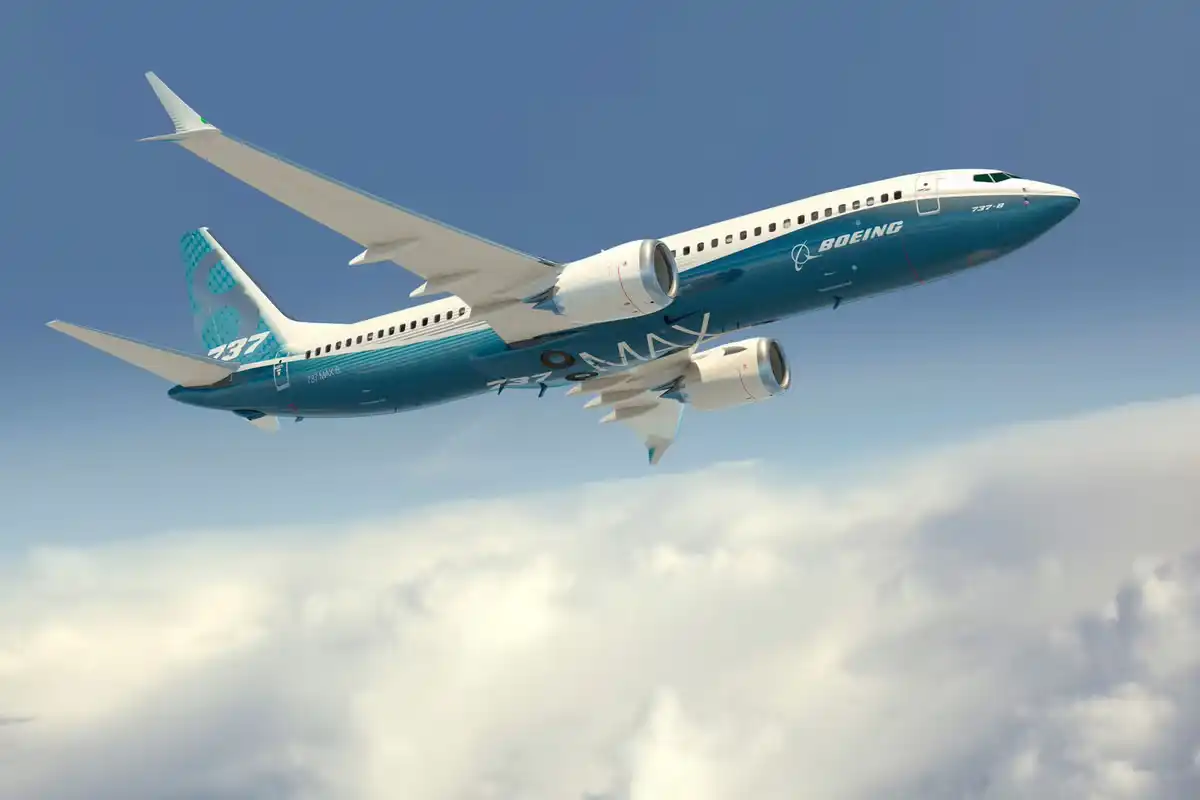 Boeing 737 MAX 8 cruising above cloud layer on ultra long domestic flight