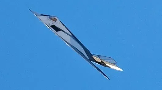 F-117 Nighthawk with experimental metallic stealth coating flying test mission