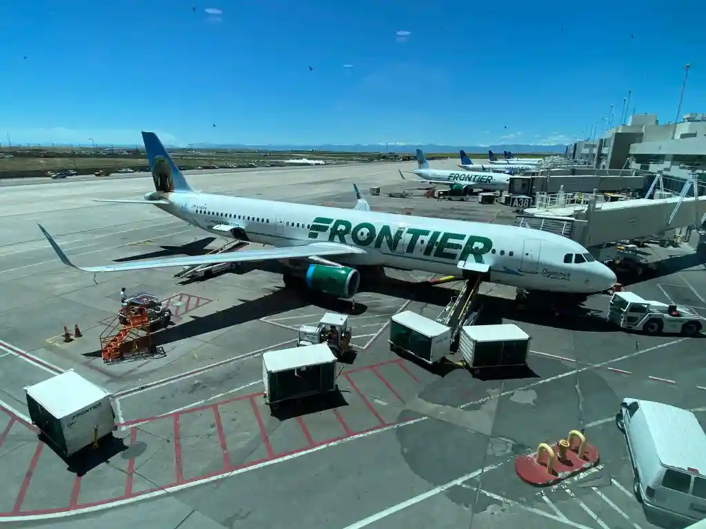 Frontier Airlines passengers boarding Airbus A321 at US airport terminal