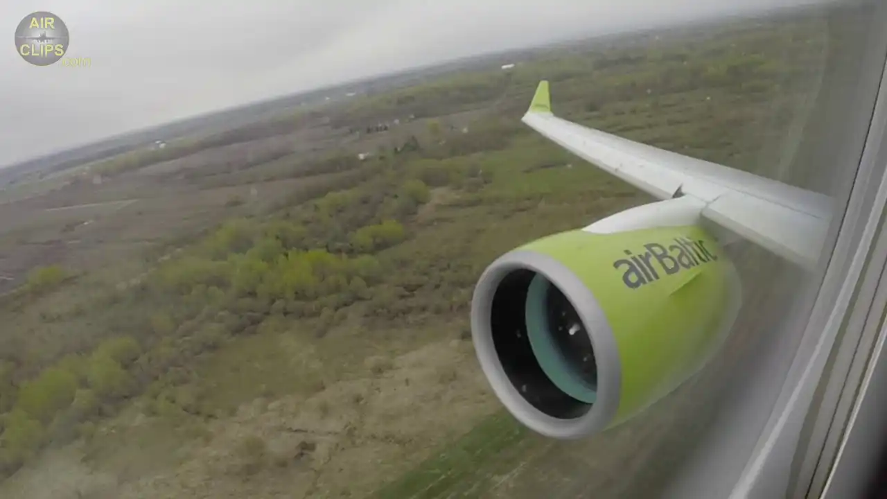 Pratt Whitney PW1500G engine mounted on Airbus A220 wing during daylight