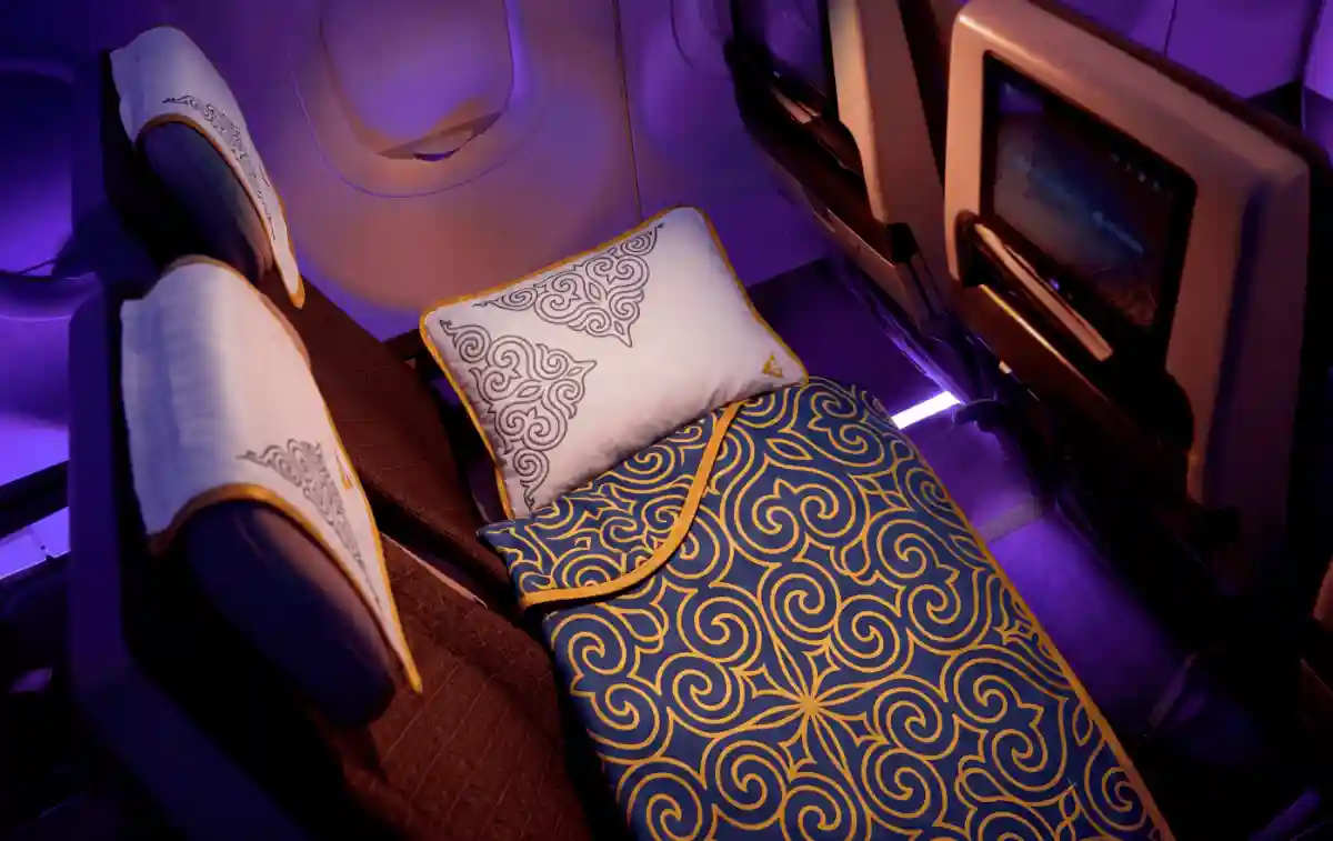Air Astana Economy Sleeper three-seat bed mattress duvet Almaty international flight