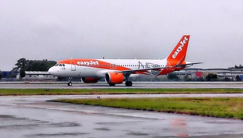 Apollo Global Management easyJet takeover announcement with easyJet Airbus A320 aircraft at London Gatwick Airport