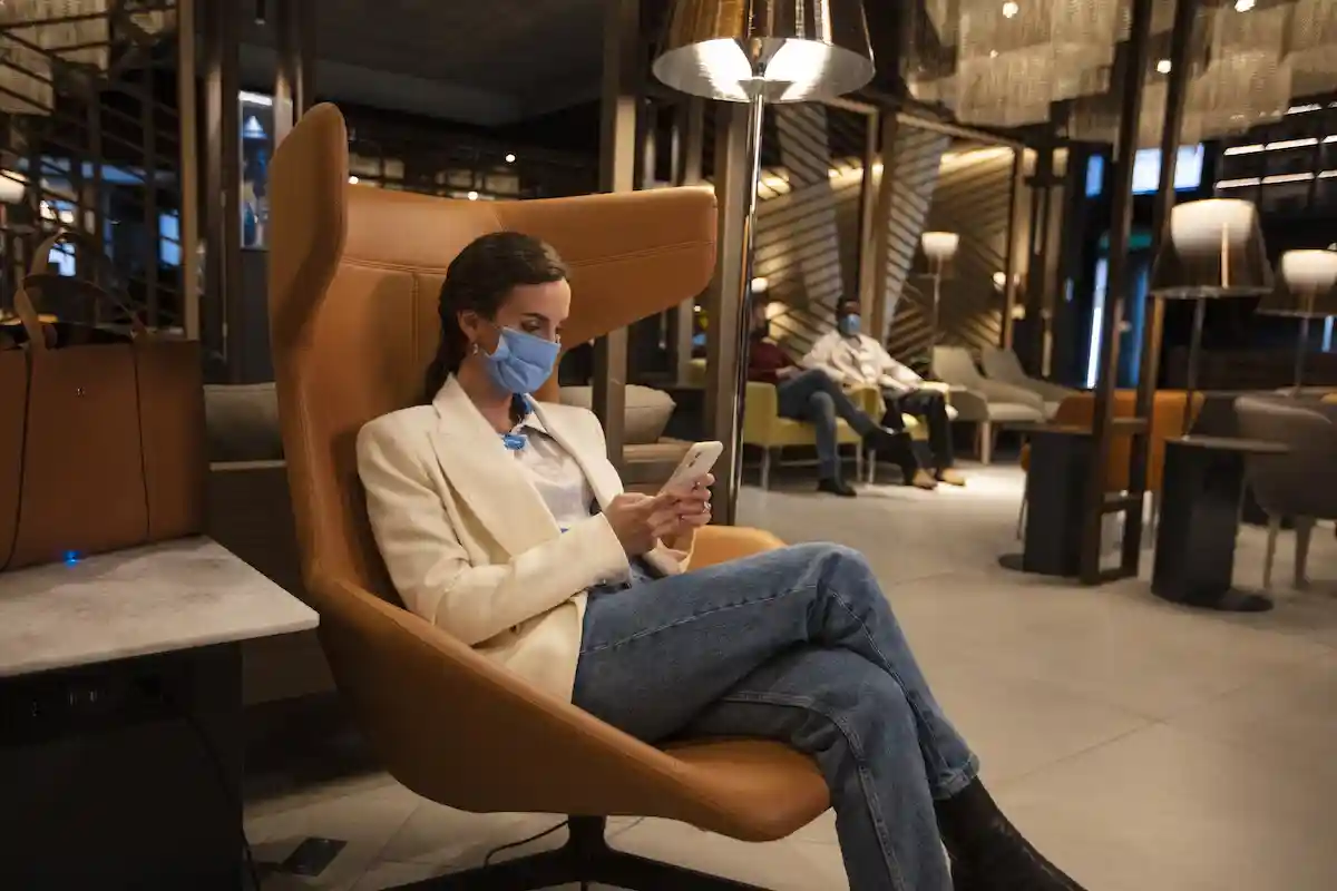LATAM international premium economy passengers at a business lounge in Santiago Airport