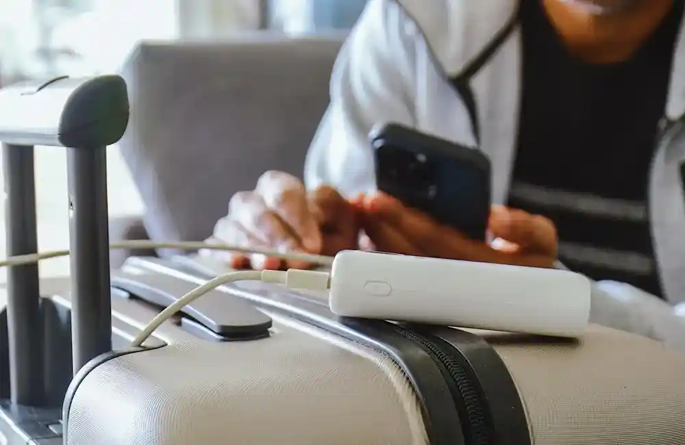 portable lithium-ion power banks visible inside carry-on luggage during CT airport screening