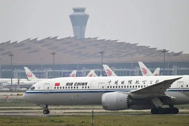 Boeing and Airbus commercial aircraft at major Chinese airport terminal
