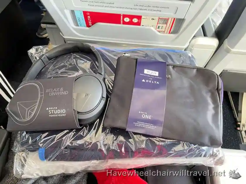 Delta Premium Select amenity kit noise-canceling headphones and seat power