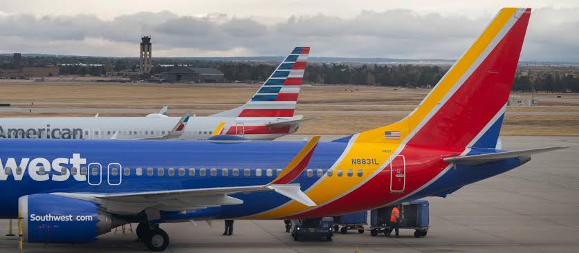 Colorado Springs Airport terminal with Southwest Airlines plane departing for Cancun Mexico
