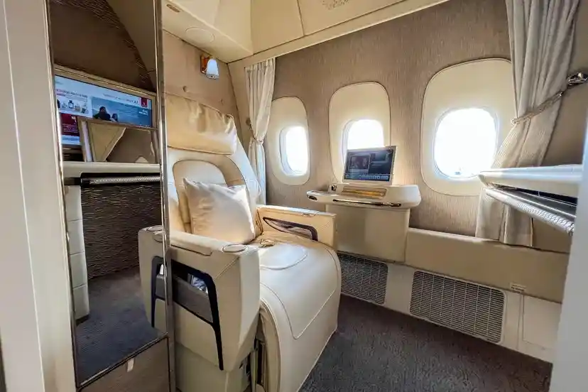 Emirates Boeing 777 eight-suite first class cabin with private doors and personal minibar